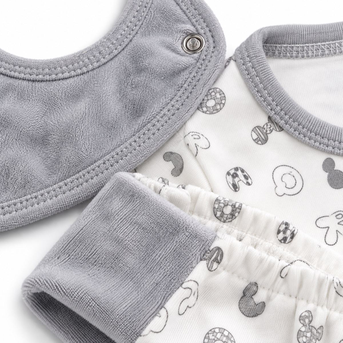 7 Piece Winter Starter Set Disney Gray & White — Fabric and bib detail