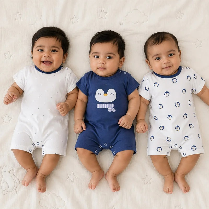 Additional view of navy blue and white short-sleeve cotton baby rompers with penguin prints from the pack of 3